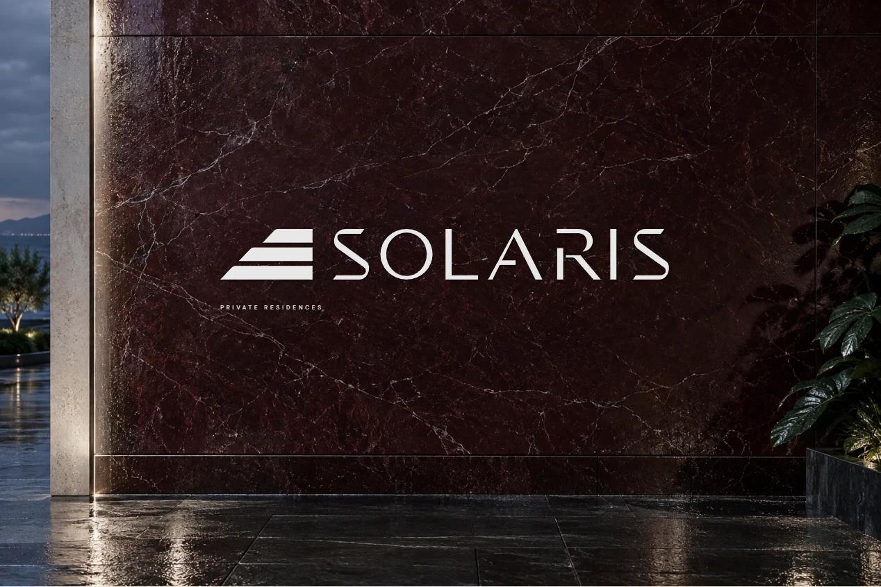 Solaris identity on a burgundy stone signage concept