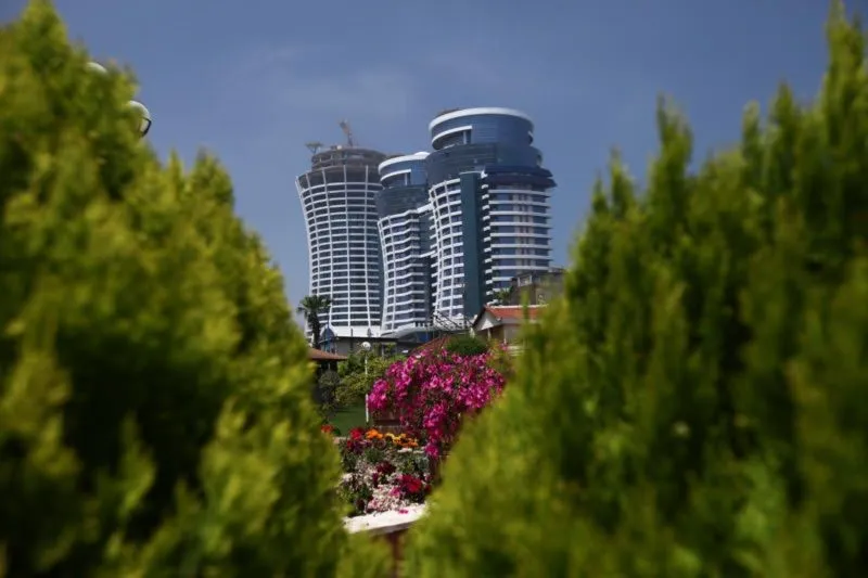 Visitor photograph showing Ghoo twin towers and their sculpted rooftop crowns