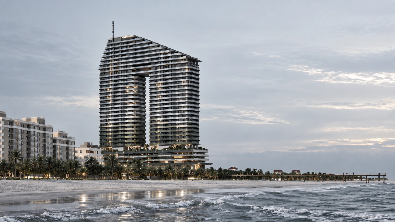 The full Solaris tower and its stepped crown overlooking the beach and Caspian Sea
